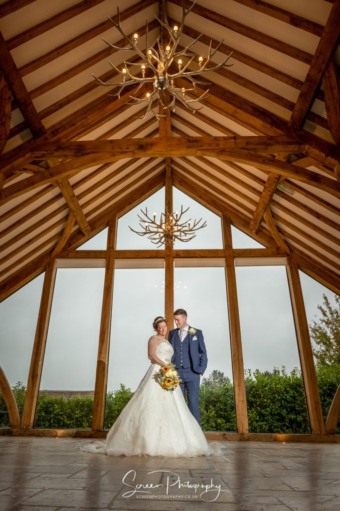 married wedding couple at Swancar Farm Country House inside glass barn
