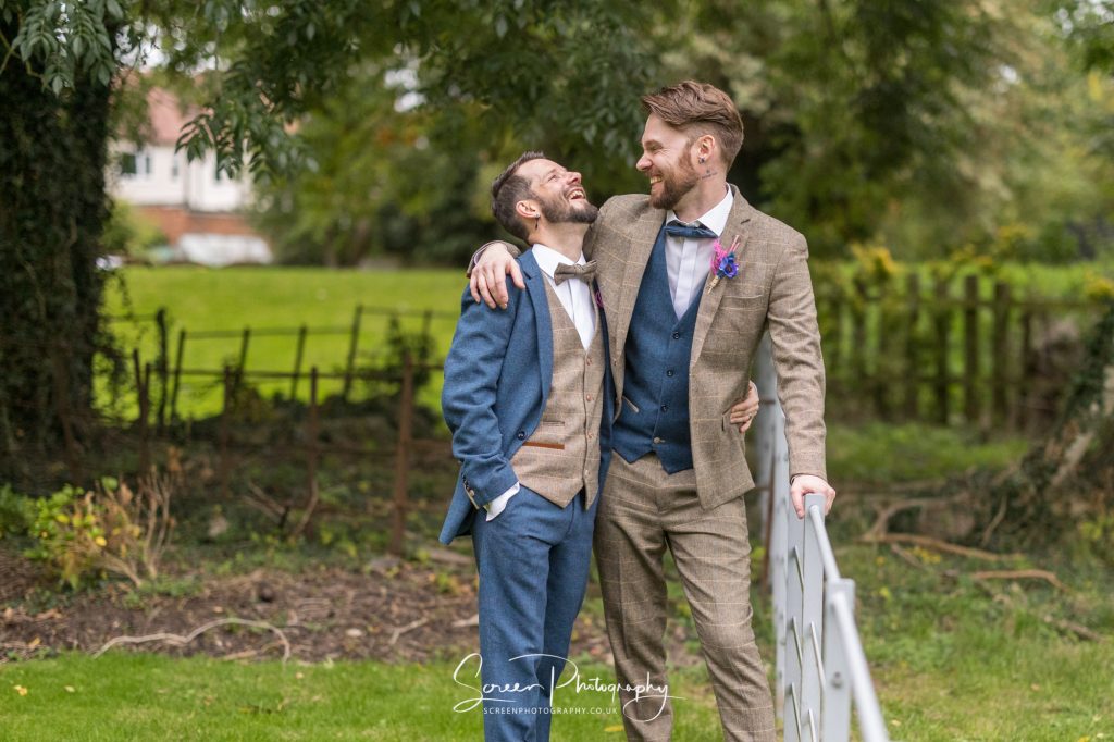 two men married in tweed suits LGBT LGBTQ+ male same sex wedding ceremony