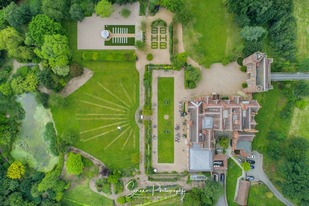 drone aerial photograph looking top down on Hodsock Priory garden lake Nottingham Notts wedding venue 