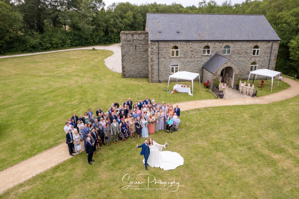 Peak District darwin lake holiday village drone wedding group image with hall
