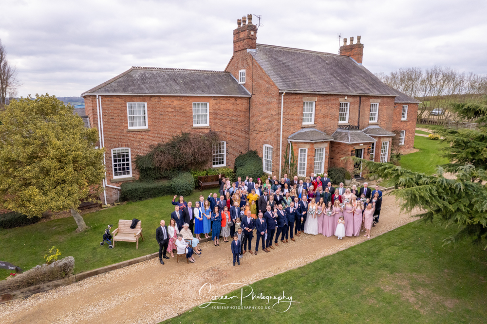 Swancar Farm Country House outdoor group photograph picture of guests with drone out the front