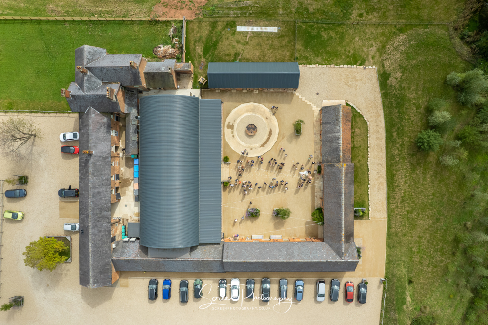 Cripps & Co Grangefields Derby Ashbourne wedding venue barn drone uav aerial view look down confetti