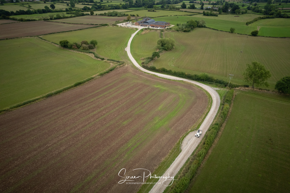 Cripps & Co Grangefields Derby Ashbourne wedding venue barn drone uav aerial view classic car drive