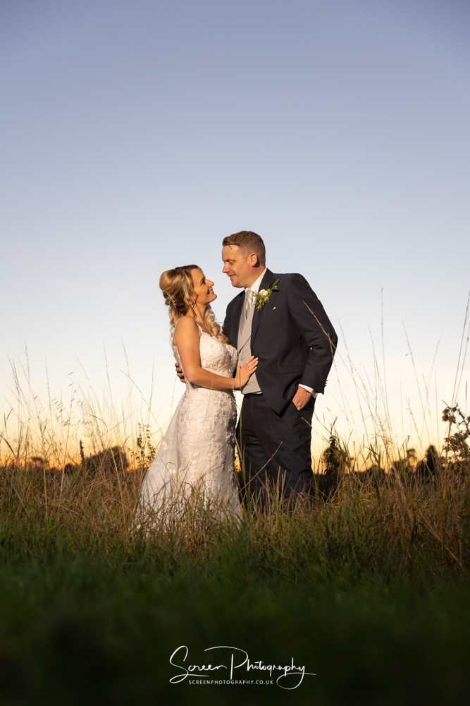 Cripps & Co Grangefields Derby Ashbourne wedding venue barn sunset married couple bride groom sun dusk