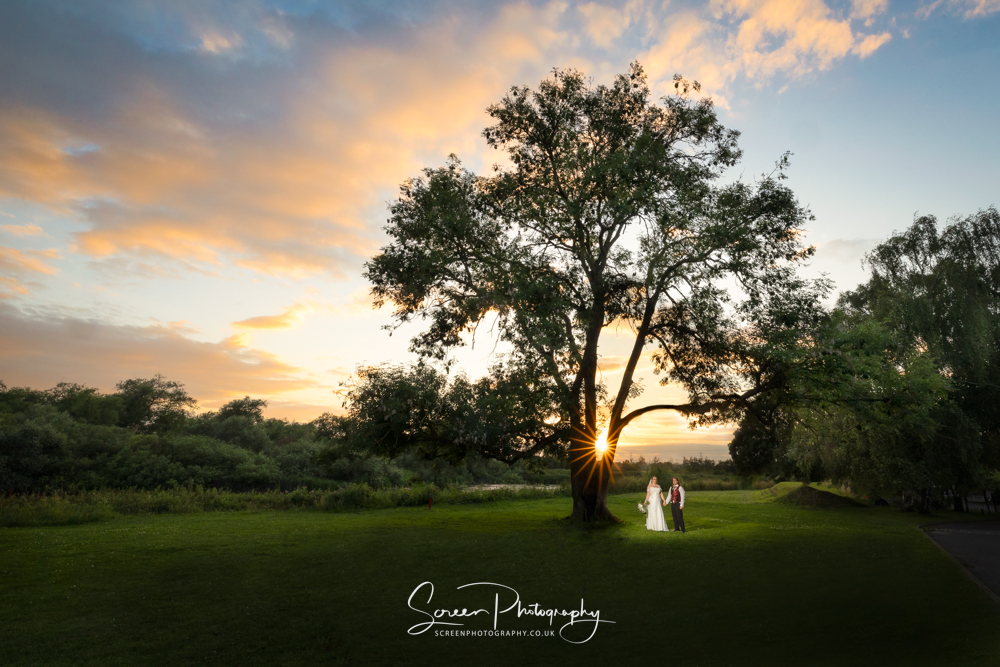 The priest house by the river castle Donington Derbyshire wedding venue hotel Derwent tree sunset sunburst