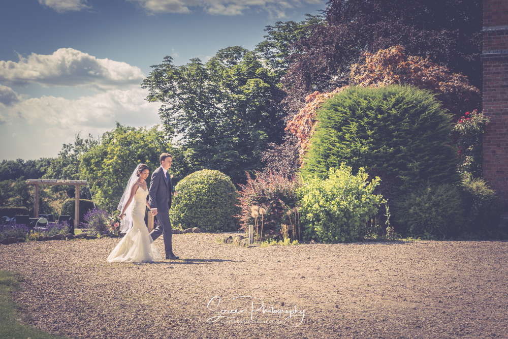 The Shottle Hall Estate Wedding Venue Derby Derbyshire couple married walking hand in hand