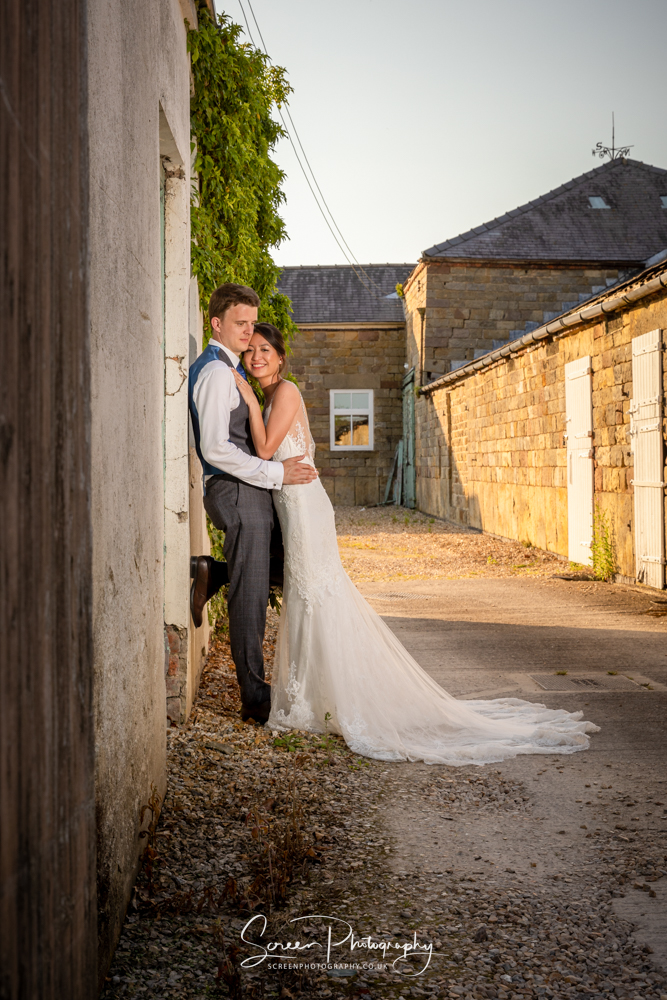 The Shottle Hall Estate Wedding Venue Derby Derbyshire couple bride groom sunset barns