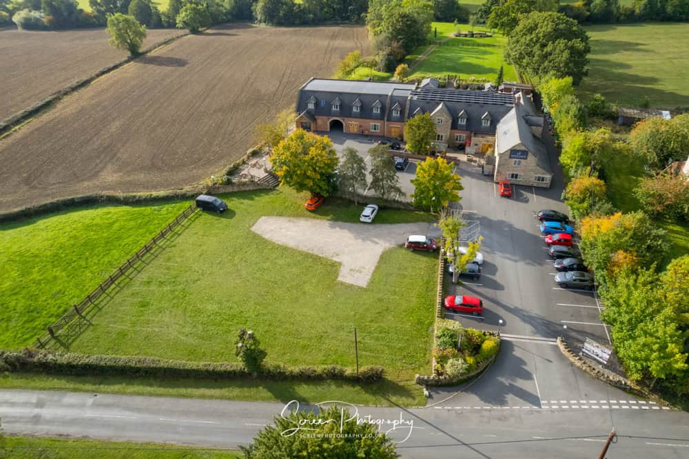 The white hart wedding photography drone aerial view of the pub countryside and venue