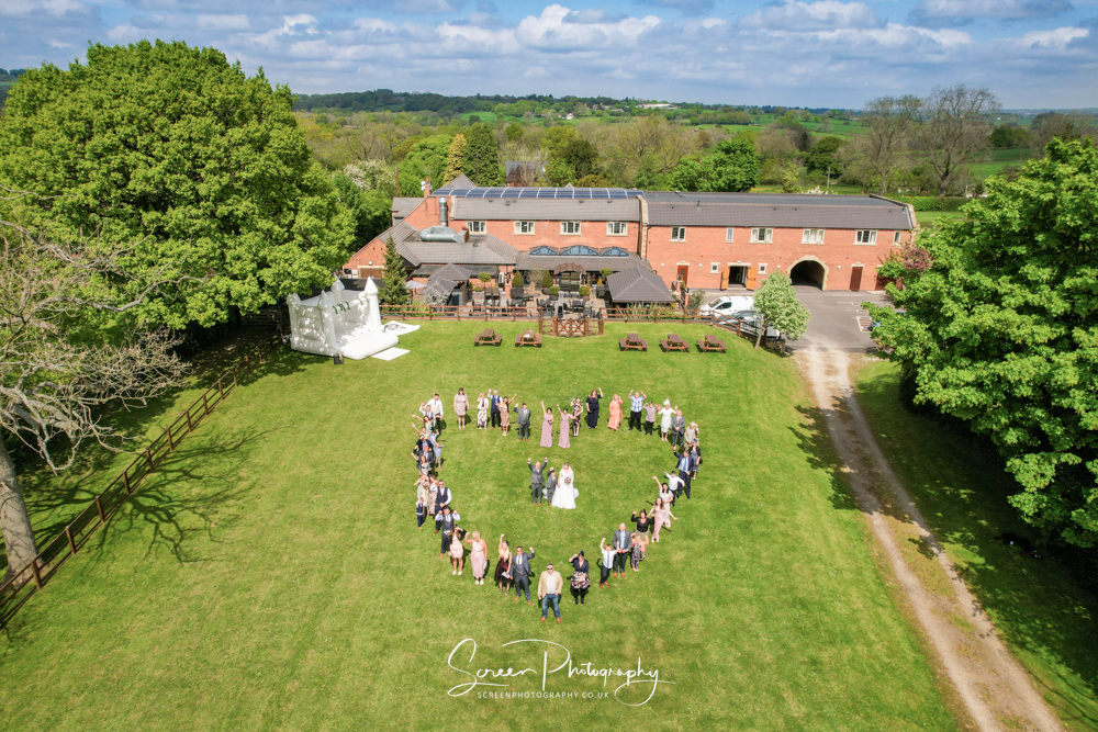 The white hart inn moorwood moor Alfreton wedding venue photography drone aerial heart framed group family friend rear garden