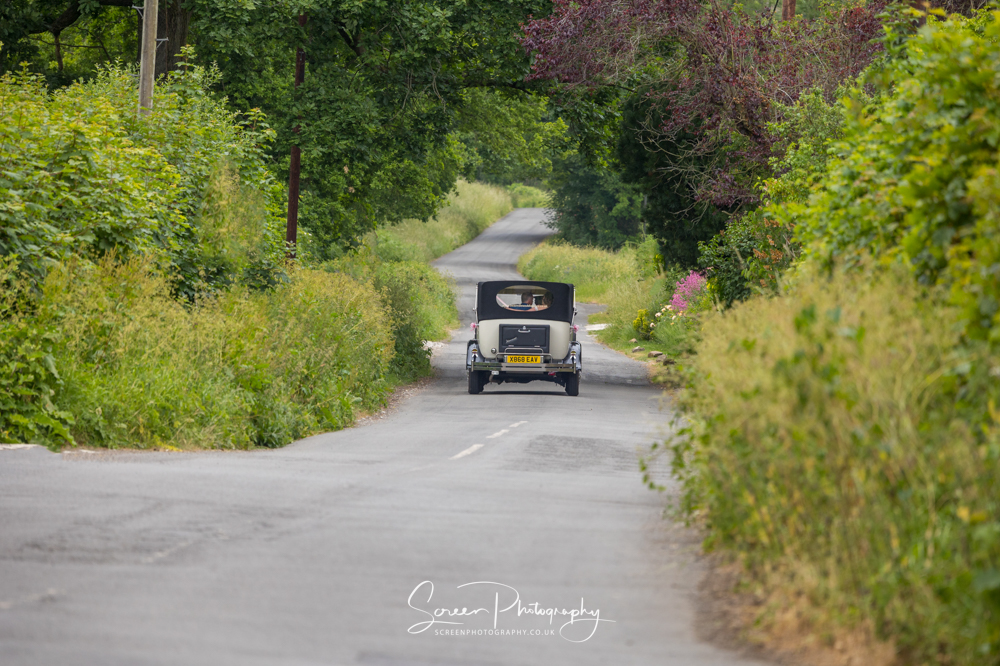 Horsley Lodge Derbyshire Peak District wedding golf venue  photography couple driving classic car lane