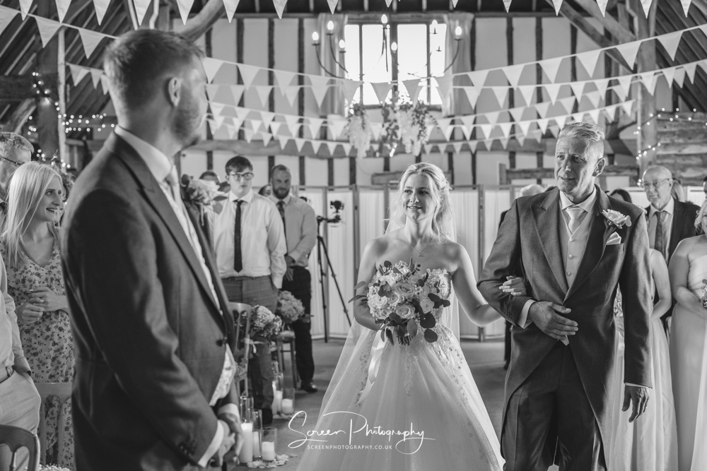 Clock Barn wedding venue Hampshire Berkshire walking down the aisle first look indoor ceremony bride and groom