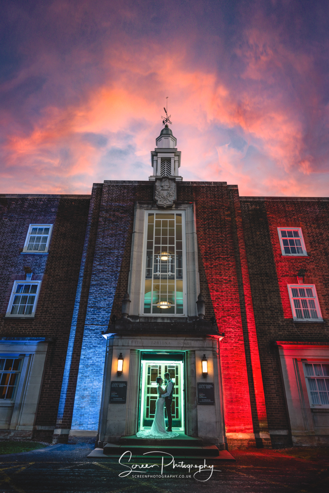 derby conference centre unique creative wedding photograph in doorway at dusk and sunset
