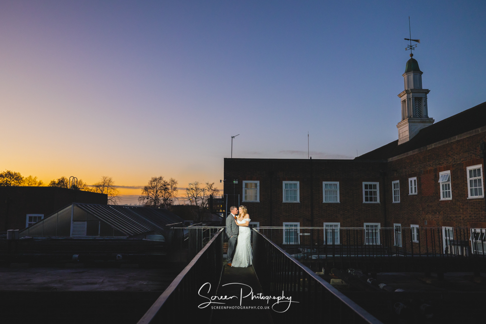the derby conference centre unique creative wedding photograph on the roof top at dusk and sunset