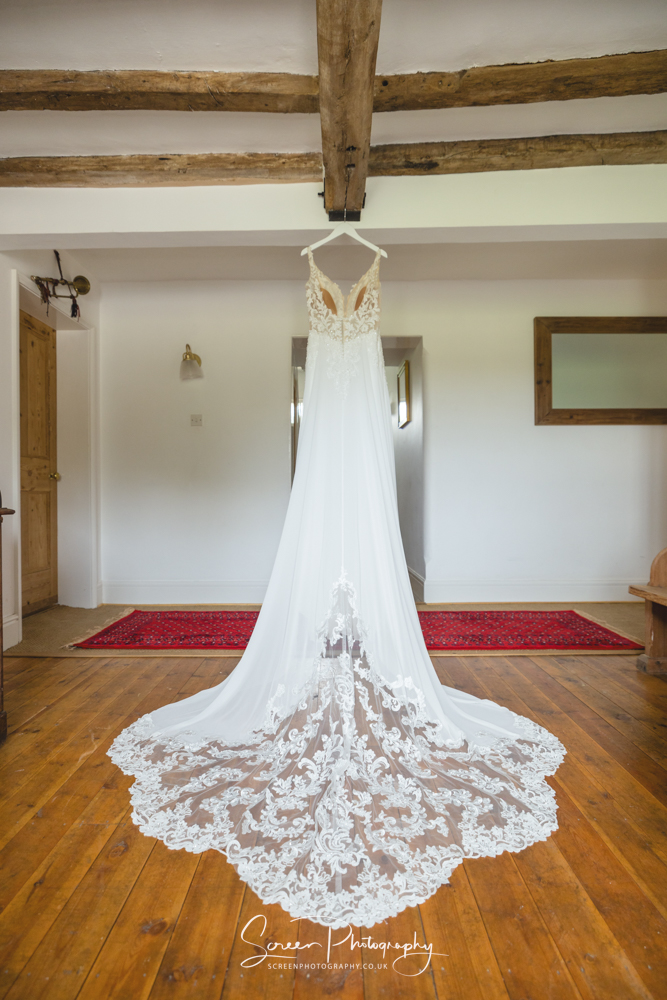 The Mill Hoveringham wedding barn watermill venue boots Newark wedding dress hanging from house hotel