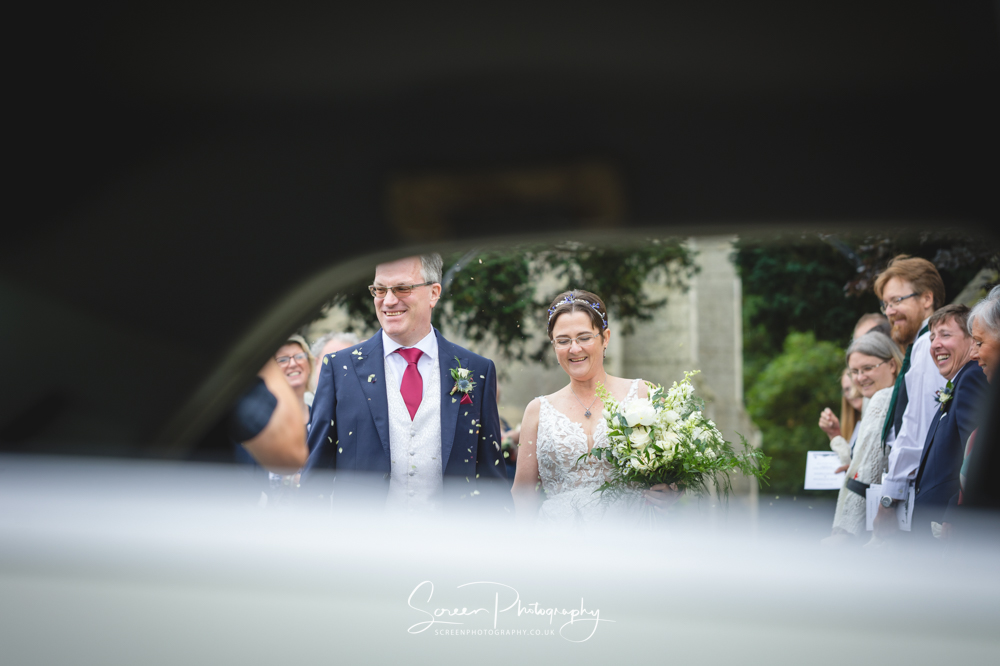 The Mill Hoveringham wedding married couple bride groom through wedding car window