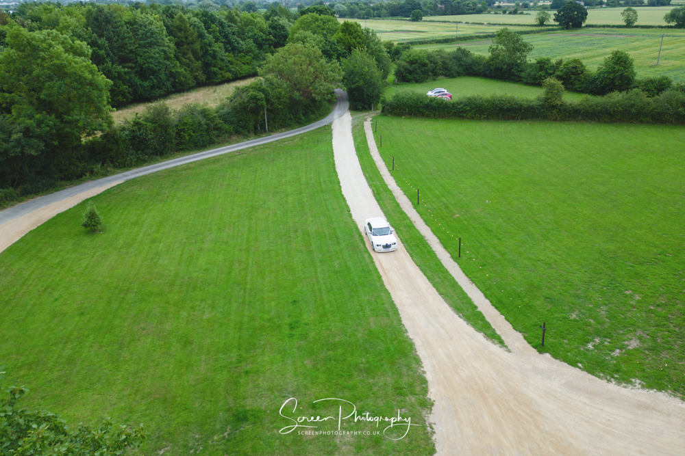 The Mill Hoveringham wedding watermill venue near Nottingham Newark entrance drone bride groom car arriving