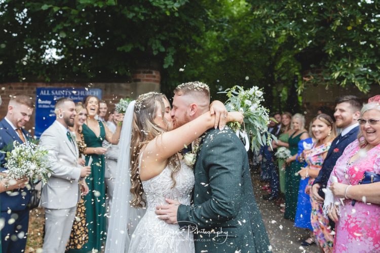 All Saints Church Long Eaton Nottingham Derby wedding confetti kiss