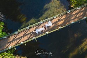 hackles grange Scarborough east ridings Yorkshire married couple bride bride same sex lesbian gay classy picture drone looking down on bridge