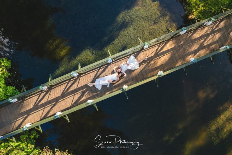 hackles grange Scarborough east ridings Yorkshire married couple bride bride same sex lesbian gay classy picture drone looking down on bridge