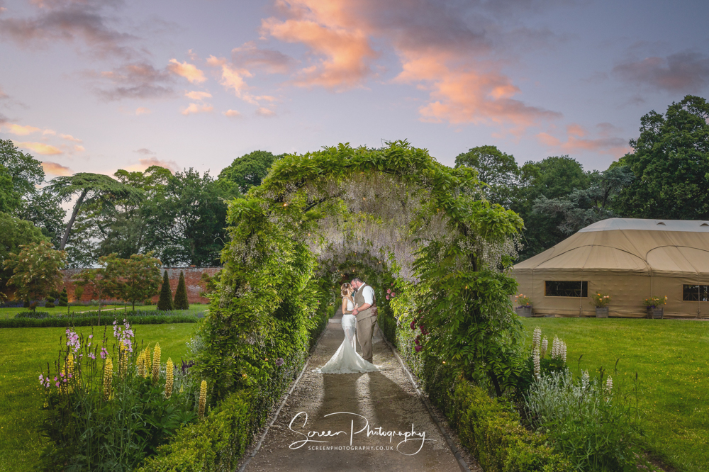 Thorpe Gardens Cripps & Co wedding venue Tamworth Birmingham married couple bride groom in wall gardens at sunset