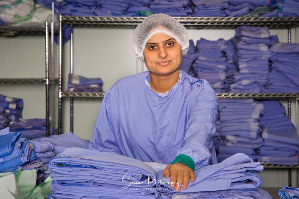 commercial photography nottingham business corporate headshot of lady in a sterile cleaning company environment wearing blue gown