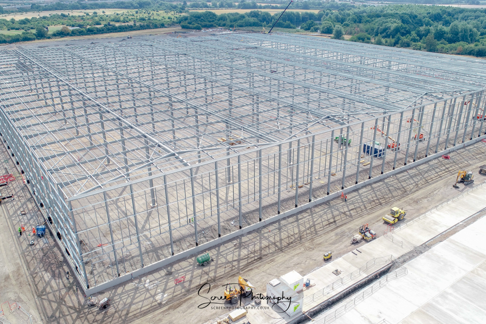 construction drone nottingham building warehouse steel work frame with crane