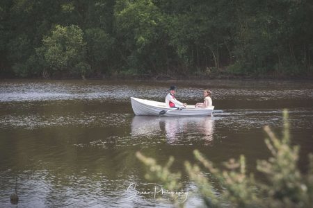 darwin lake wedding photography peak district bride groom on lake rowing a boat