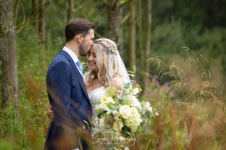 darwin lake wedding photography bride groom intimate pose kissing in forest