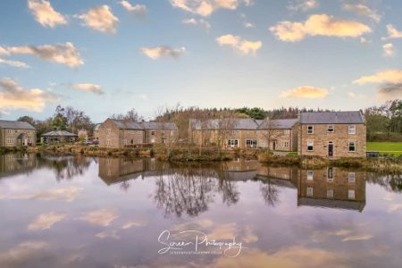 darwin lake cottages at sunset with reflection