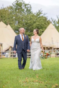 Overgrown Acres wedding photography tipi bride groom walking