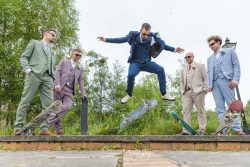 derby wedding photographer groomsmen on skateboards