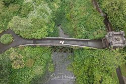 Foxtail Barns wedding photography bride groom on bridge from drone