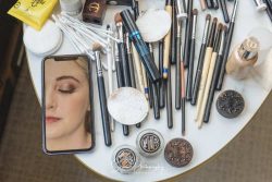 derby wedding photography bride make up on phone