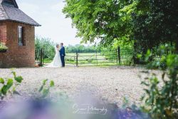 plum park wedding photogaphy towcester bride groom at gates