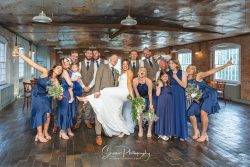 The west mill derby mills married couple in ceremony room with bridal and groom party fun photo picture