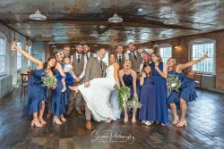 The west mill wedding photography derby mills married couple in ceremony room with bridal and groom party fun photo picture