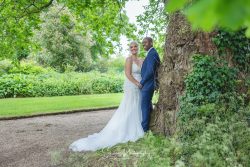 Whatton House TiPi wedding venue married couple bride groom walking resting on tree