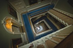norwood park wedding photography bride groom looking down main stair case