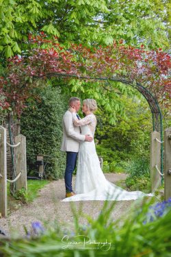 Morley Hayes golf and wedding venue married couple having a moment in the woodland gardens