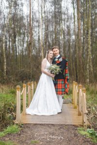 darwin lake wedding photography bride groom on bridge in kilt