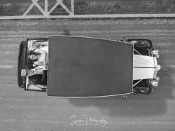 derby conference centre bride and groom in classic looking up at the drone