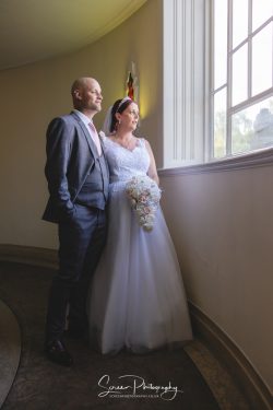derby conference centre wedding photography bride groom looking out of window