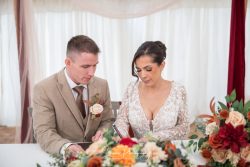 Spring lakes wedding events nottingham bride groom signing certificate