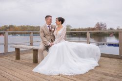 Spring lakes wedding events nottingham bride groom sat outside on lake