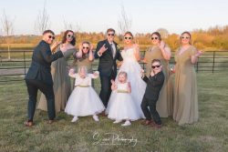 stretton manor barn wedding photography bride groom with bridal party having fun in shades sunglasses