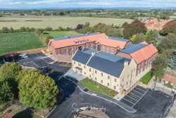 commercial drone nottingham of residnetial care home with car park and beautiful green fields around