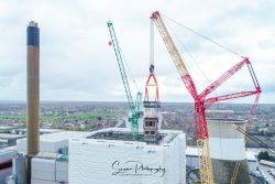 commercial drone nottingham aerial view or large mobile crane extracting old boiler unit from a power station