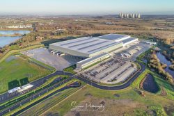 commercial drone nottingham aerial view of warehouse and offices with ratcliffe power station chimneys in distance background