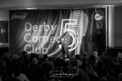 commercial photography nottingham derby comedy club with comedian on stage with audience