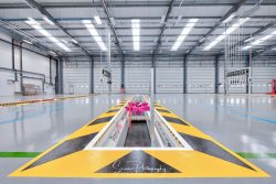 commercial photography nottingham lorry bus low level workshop area premier pits with roller shutter doors and hoses